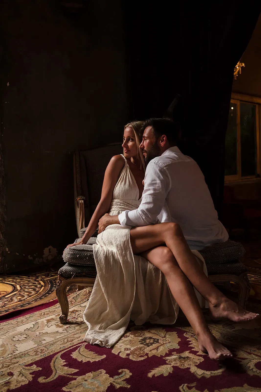 Romantic couple portrait session in luxury Riviera Maya resort with elegant lighting and traditional Mexican decor