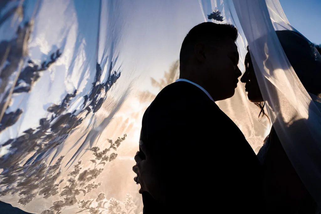 Romantic couples silhouette at sunset beach wedding in Cancun Riviera Maya Mexico destination photography session