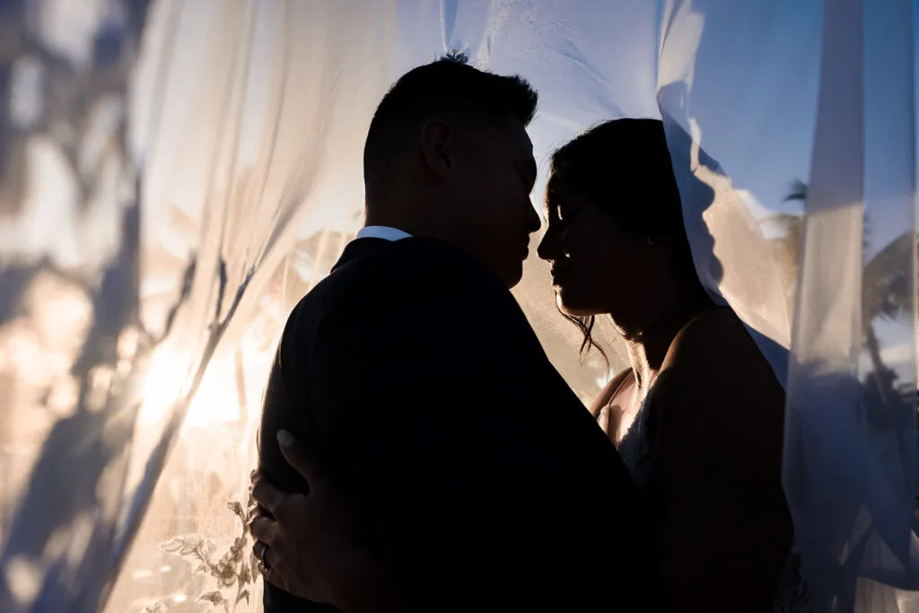 Romantic couple silhouette at sunset wedding in Cancun Riviera Maya Mexico destination photography intimate moment