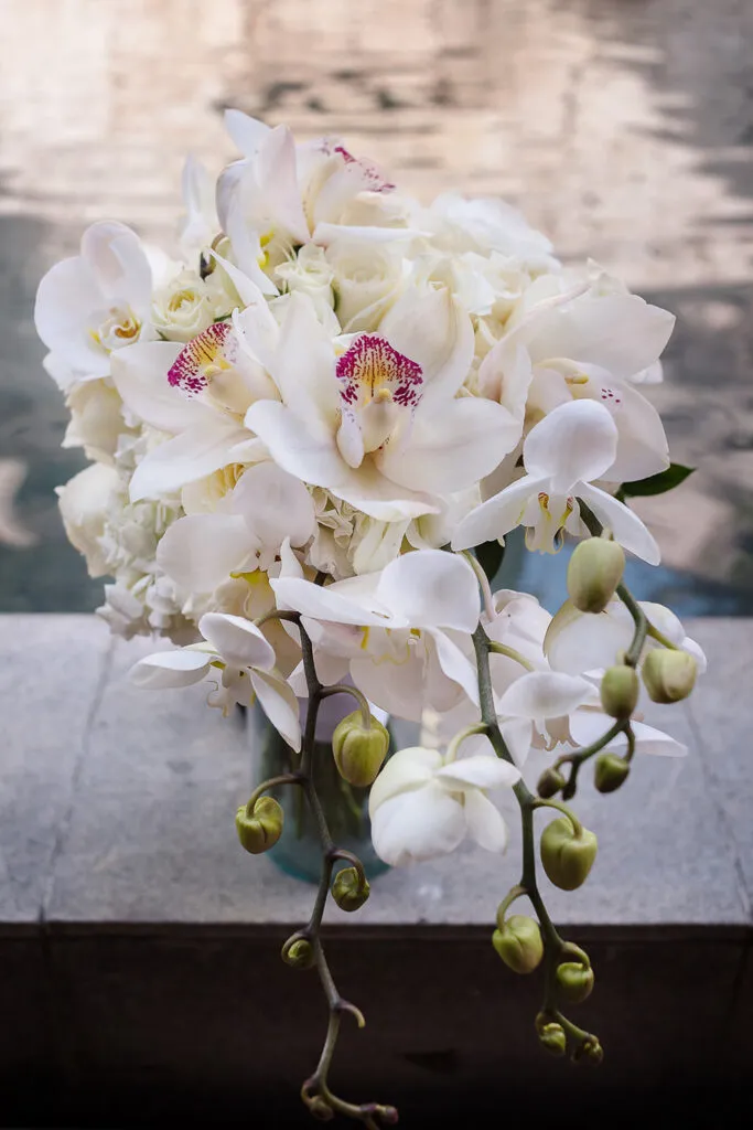 White orchid and rose bridal bouquet for destination wedding in Cancun Riviera Maya Mexico beach ceremony