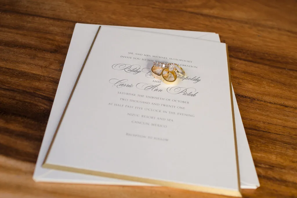 Wedding invitation and gold rings for destination wedding celebration in Cancun Mexico Riviera Maya photography