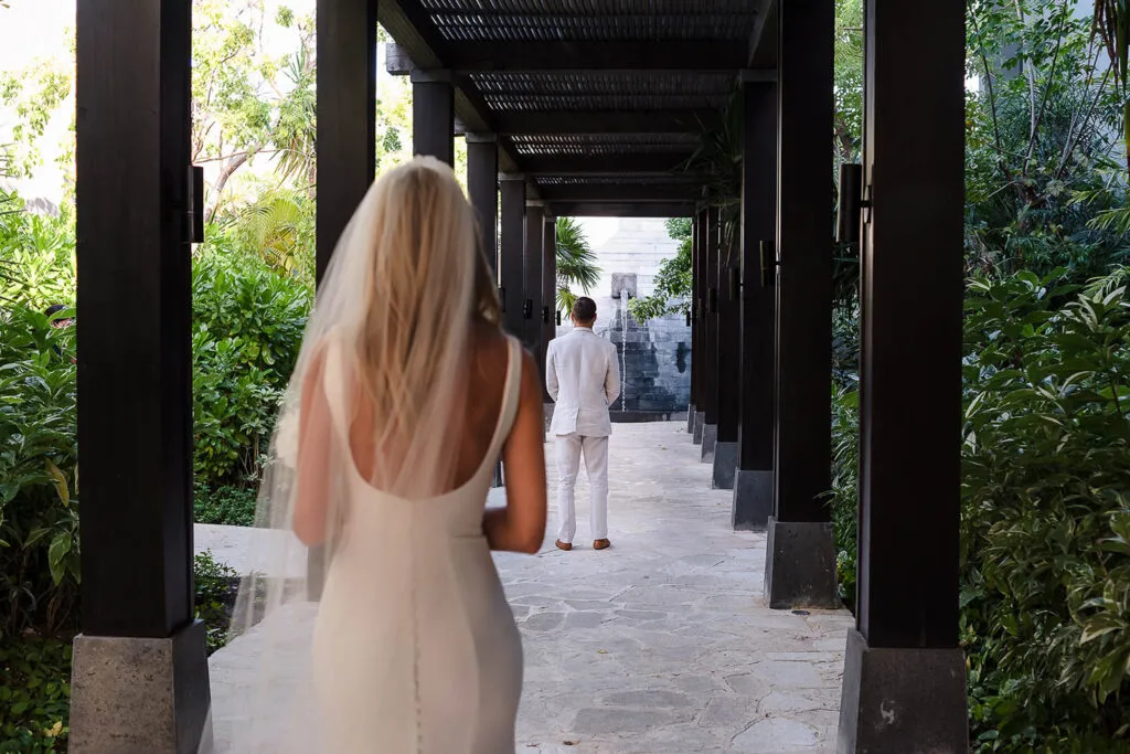 Bride and groom first look moment at luxury resort in Riviera Maya Mexico destination wedding photography