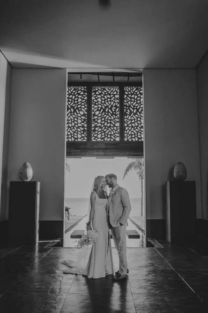 Romantic wedding couple portrait at luxury Cancun resort with ocean view - destination wedding photography Riviera Maya