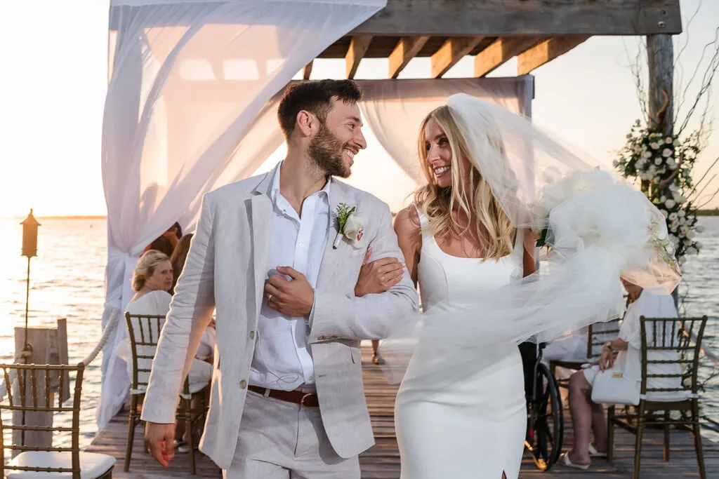 Newlyweds walking down aisle after beach wedding ceremony in Cancun Riviera Maya Mexico destination wedding photography