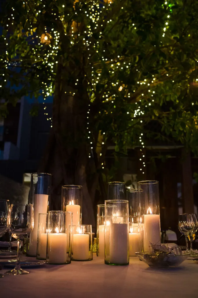 Romantic candlelit wedding reception setup with string lights in tropical Cancun Riviera Maya Mexico destination wedding