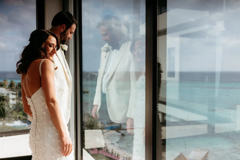 Romantic bride and groom portrait with ocean view at luxury Cancun resort wedding in Riviera Maya Mexico
