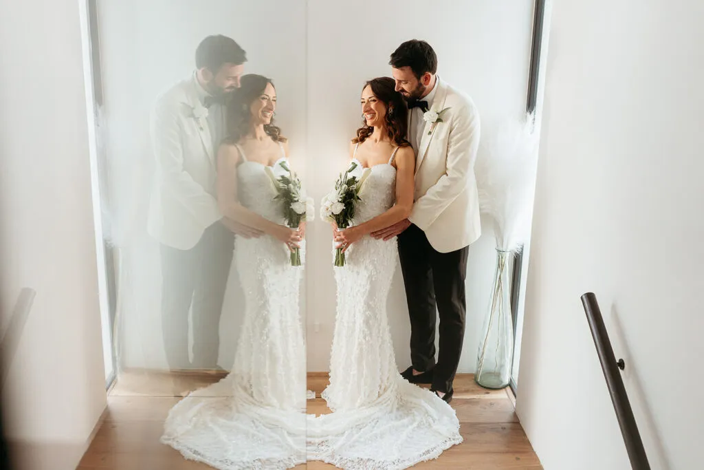 Romantic wedding couple portrait in bright Cancun venue with mirror reflection, destination wedding photography Riviera Maya