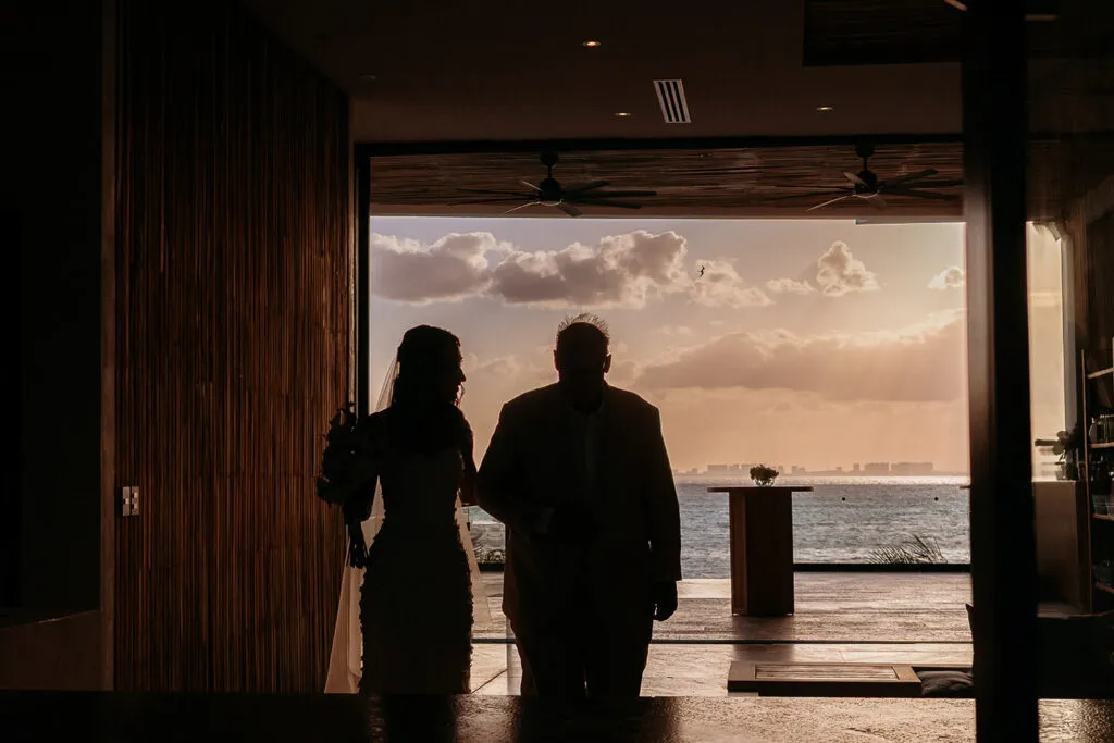 Romantic couple silhouette at sunset over Caribbean Sea in Cancun luxury resort wedding photography Riviera Maya Mexico