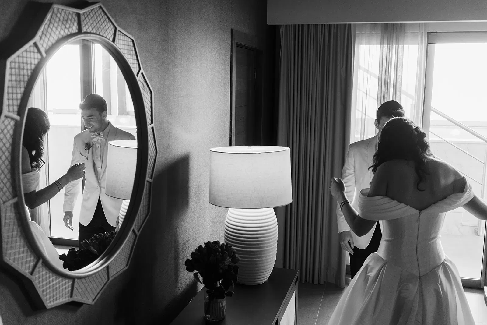 Bride getting ready reflected in mirror in black and white at Dreams Natura Resort Cancun wedding