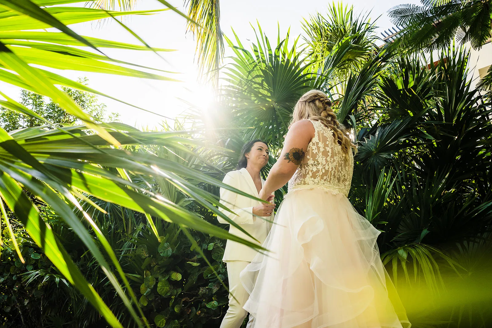 LGBTQ destination wedding Cancun - two brides in a tropical garden at Secrets Playa Mujeres by Tam Rico Photo