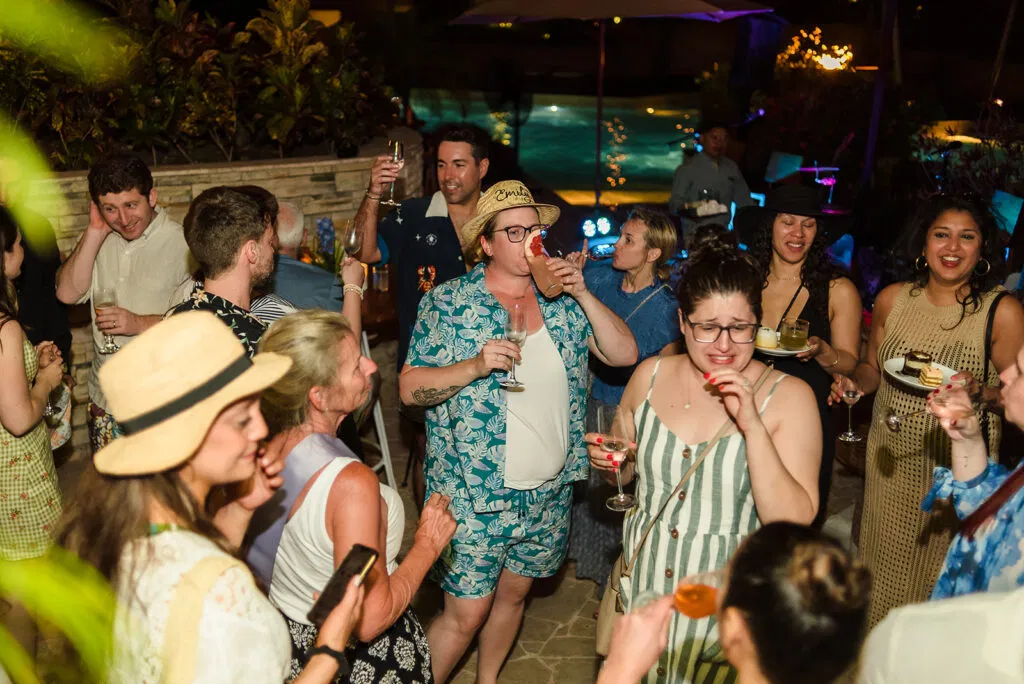 Same sex wedding celebration at Rosewood Mayakoba Cancun with LGBTQ couples dancing and toasting at tropical reception party