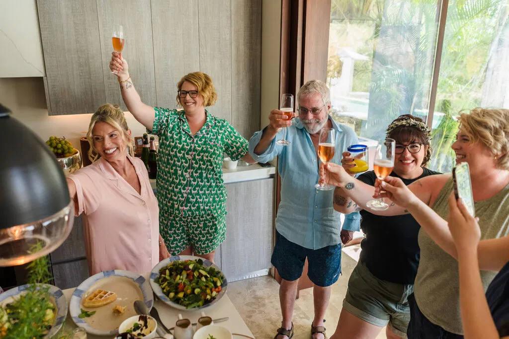 LGBTQ wedding celebration toast at Rosewood Mayakoba kitchen, same-sex couples celebrating in Cancun Riviera Maya Mexico
