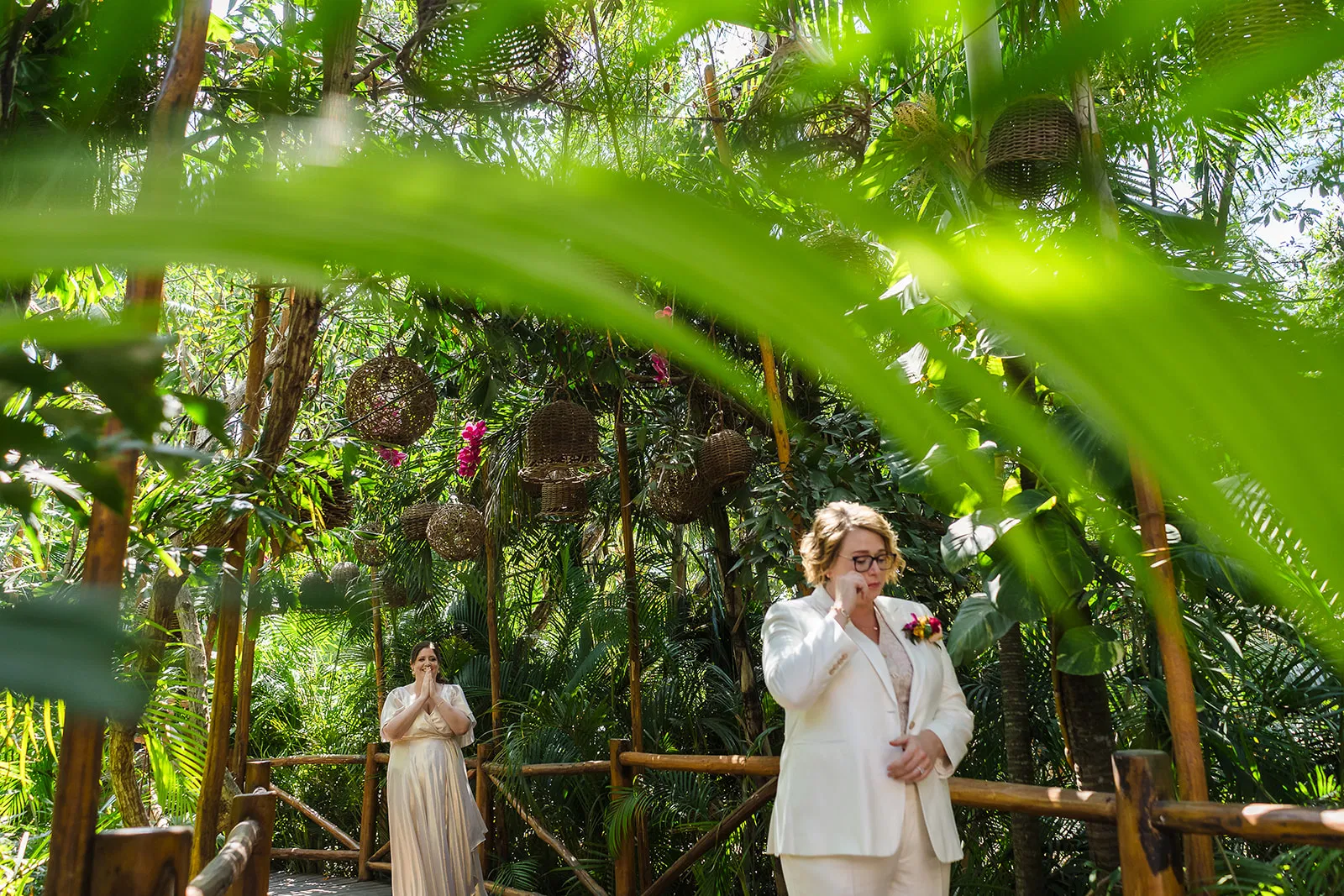 LGBTQ wedding ceremony at Rosewood Mayakoba jungle setting with same-sex couple celebrating in tropical Riviera Maya Mexico