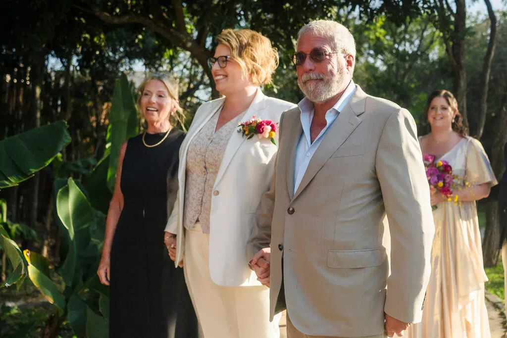 LGBTQ wedding ceremony at Rosewood Mayakoba - same sex couple walking down aisle in Riviera Maya Mexico destination wedding