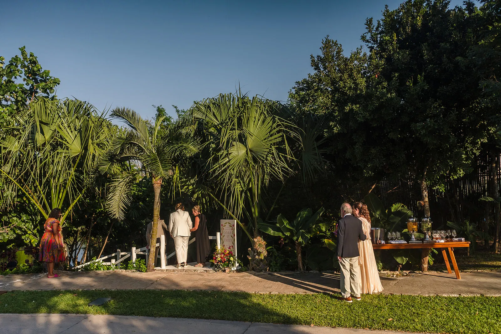 Gay wedding ceremony at Rosewood Mayakoba with tropical palms, intimate LGBTQ couples photography in Riviera Maya Mexico