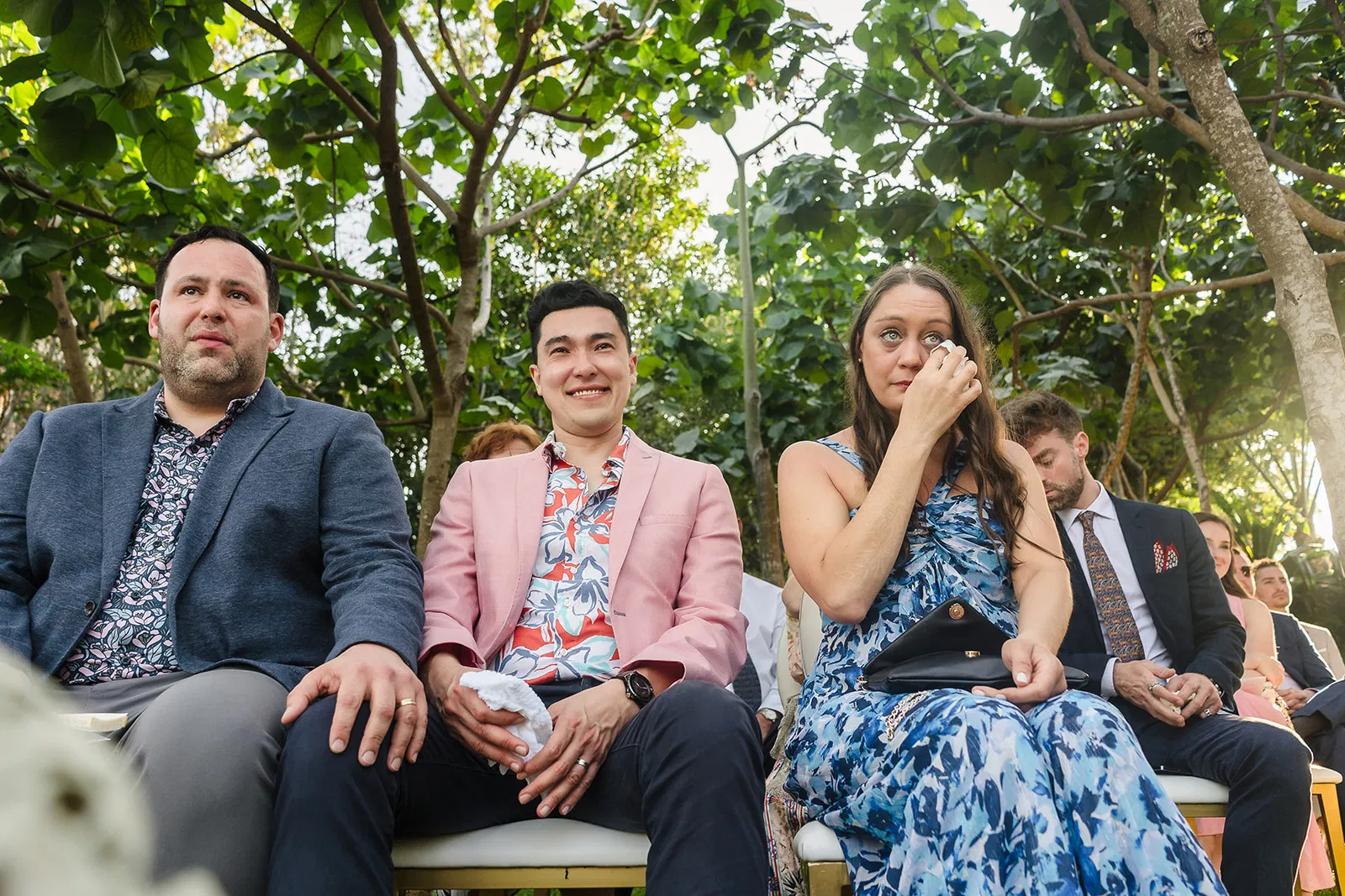 LGBTQ wedding guests emotional during same-sex ceremony at Rosewood Mayakoba, Riviera Maya Mexico destination wedding