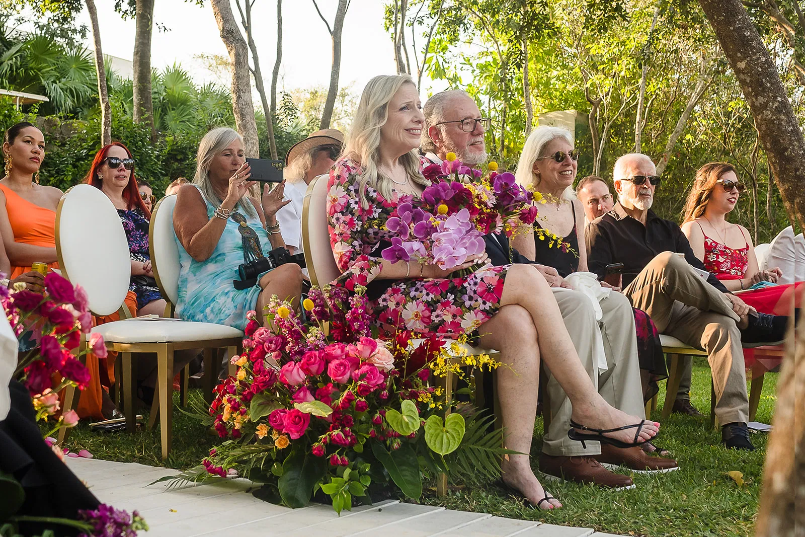 LGBTQ wedding ceremony at Rosewood Mayakoba with couple in tropical leis celebrating same-sex marriage in Riviera Maya Mexico