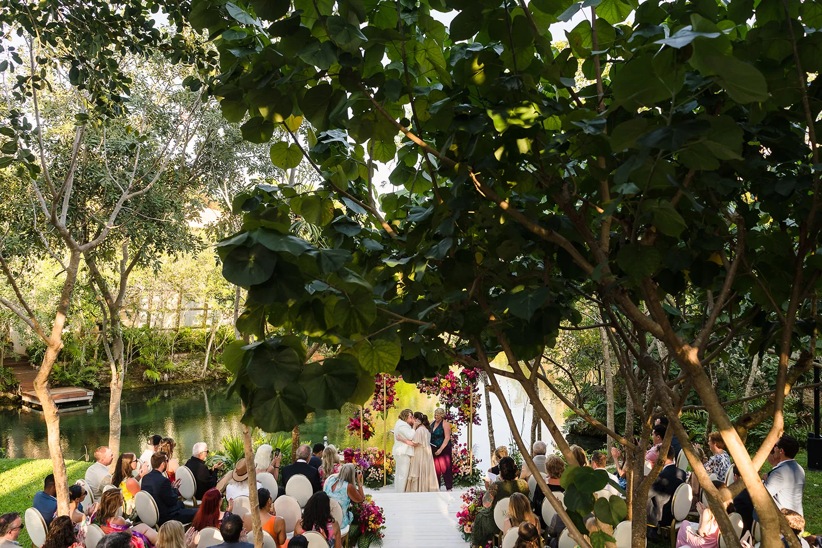 lgbtq wedding rosewood mayakoba. With same-sex couple wedding ceremony by the Lagoon. wedding photographer in Riviera Maya.
