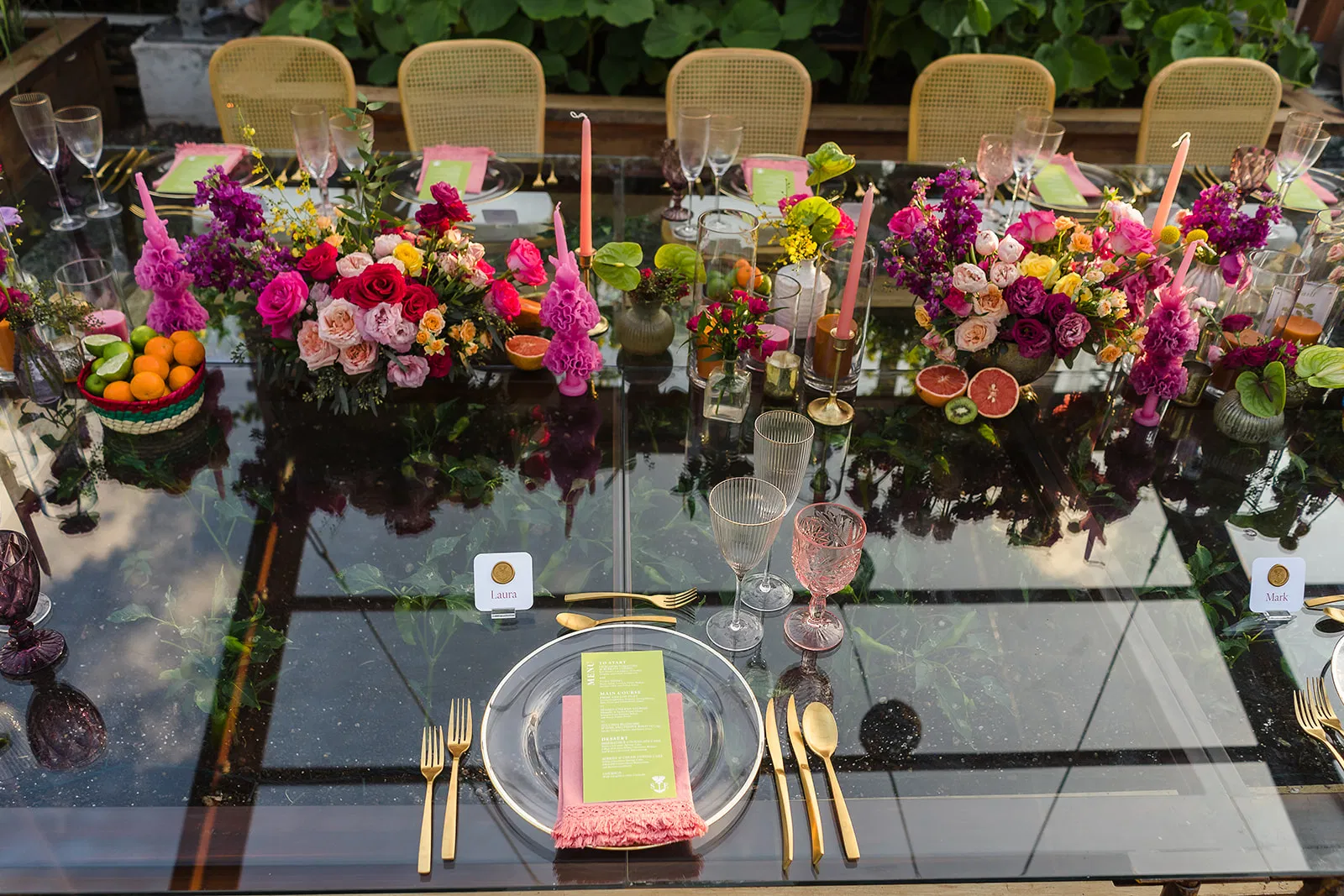 LGBTQ wedding reception table at Rosewood Mayakoba with vibrant floral centerpieces and elegant place settings in Riviera Maya