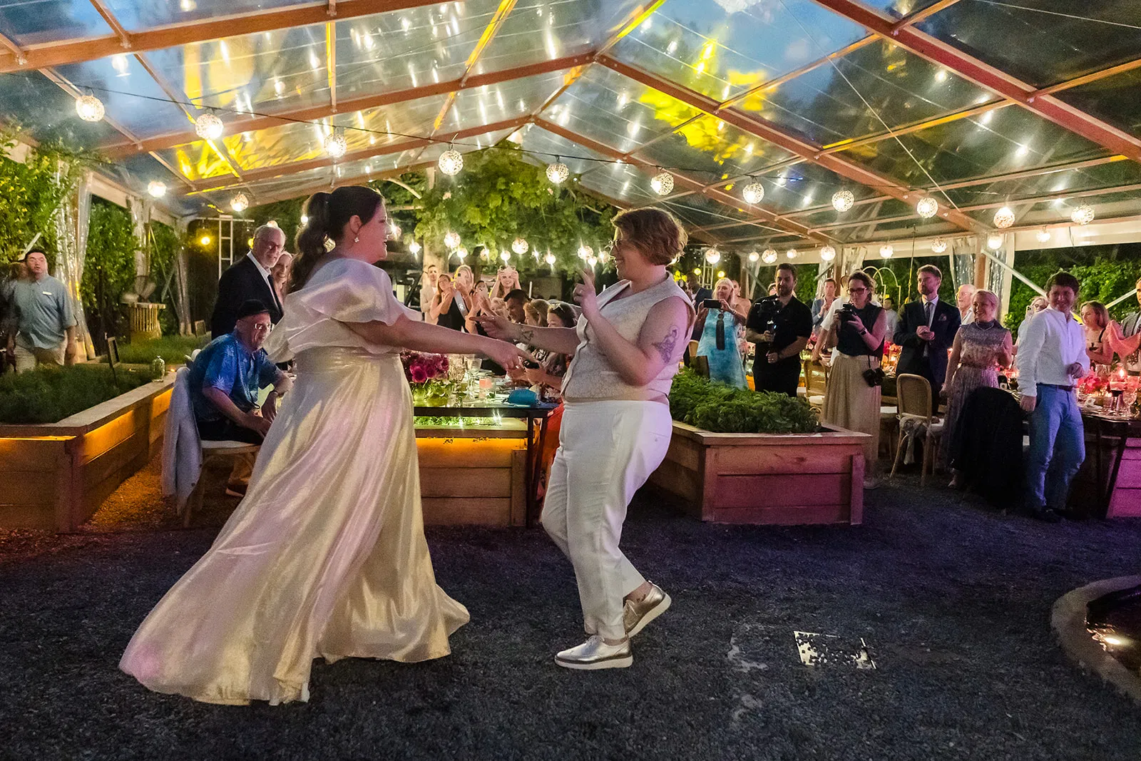 Same-sex wedding first dance at Rosewood Mayakoba, Riviera Maya - LGBTQ couples celebrating under twinkling lights in Mexico