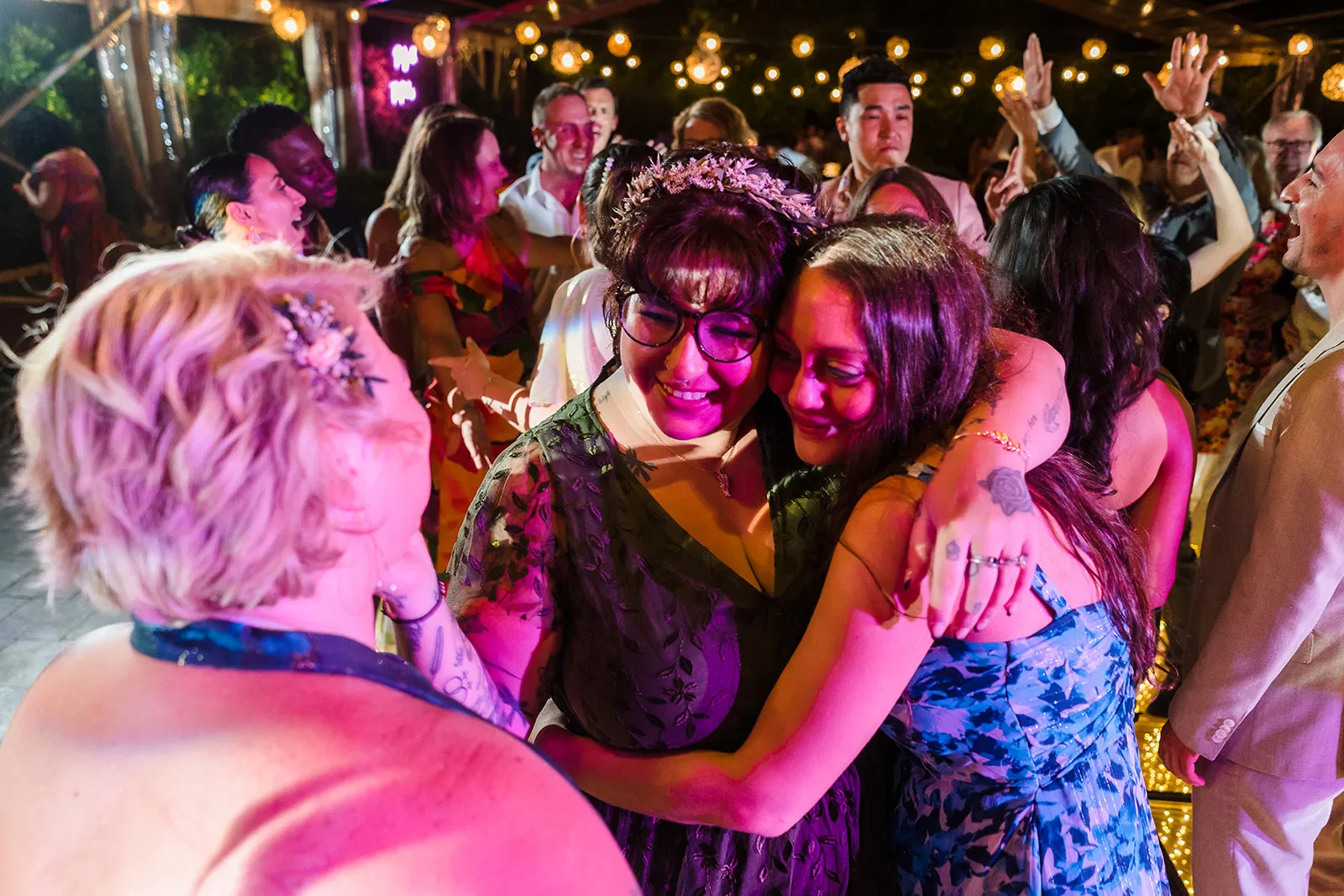 LGBTQ wedding celebration at Rosewood Mayakoba with brides embracing during reception dance in Riviera Maya Mexico