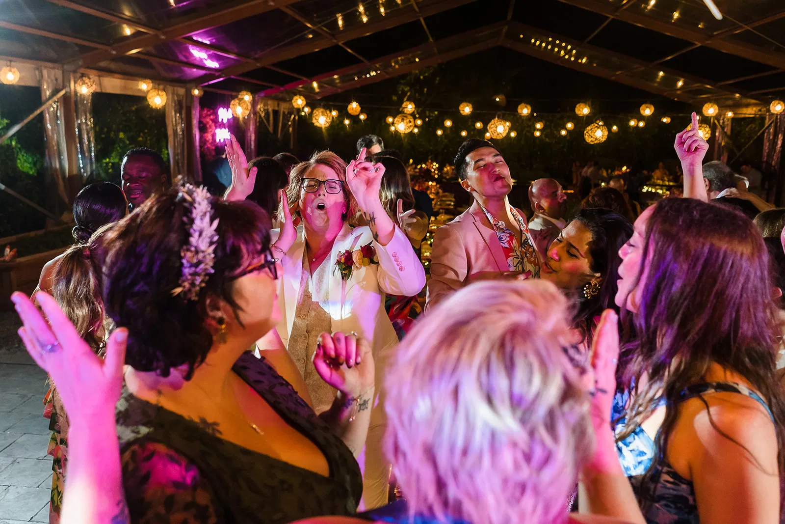 LGBTQ wedding reception dancing at Rosewood Mayakoba, Riviera Maya - same sex couples celebrate under string lights in Cancun