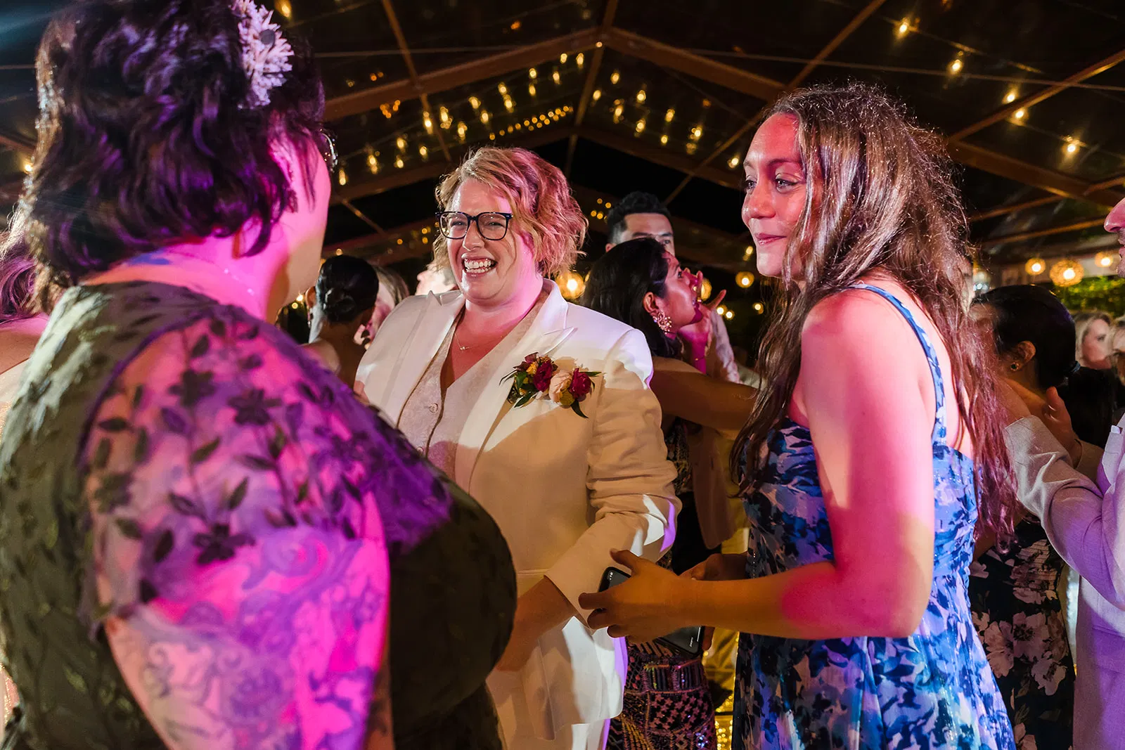 LGBTQ same sex wedding celebration at Rosewood Mayakoba Riviera Maya with brides dancing under string lights in Cancun Mexico