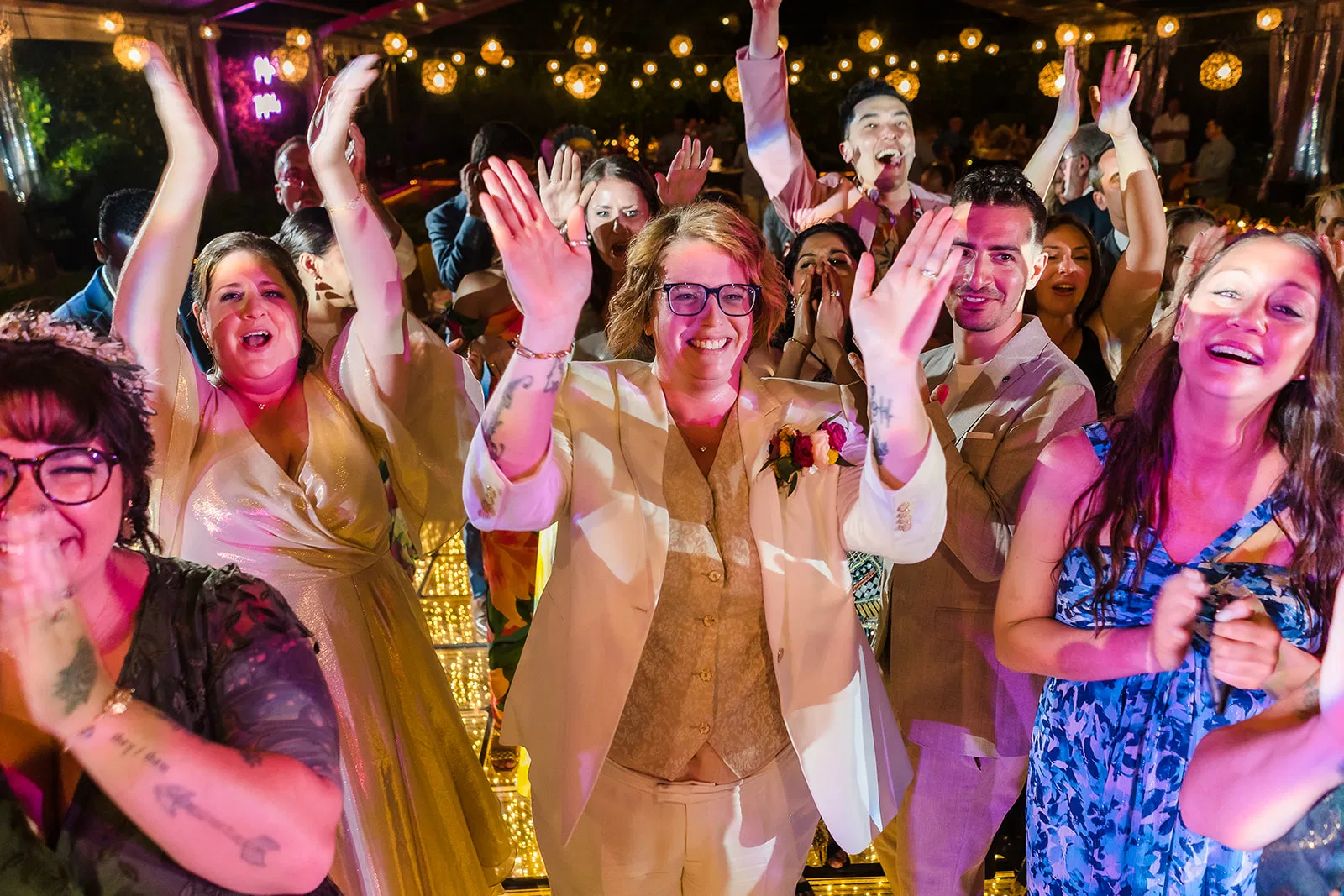 lgbtq wedding rosewood mayakoba with dancing guests under string lights in Riviera Maya Mexico